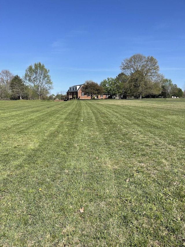 view of yard with a rural view