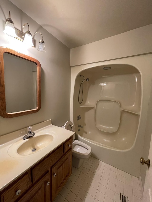bathroom with visible vents, toilet, tub / shower combination, vanity, and tile patterned flooring