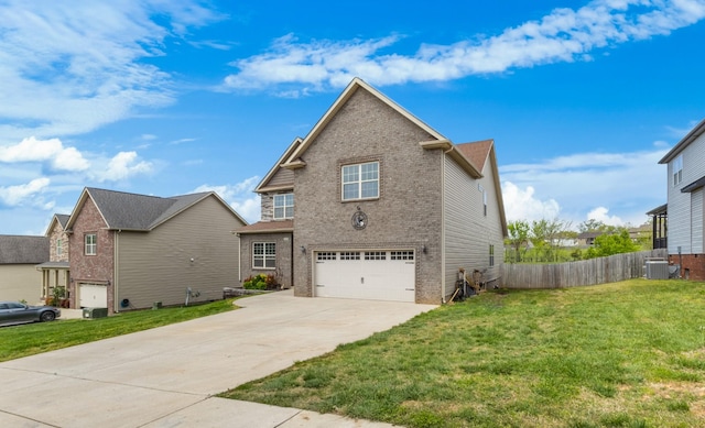 traditional-style house with central AC unit, an attached garage, driveway, brick siding, and a front yard
