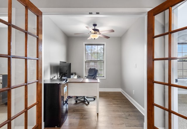 office with baseboards, french doors, dark wood-style floors, and ceiling fan
