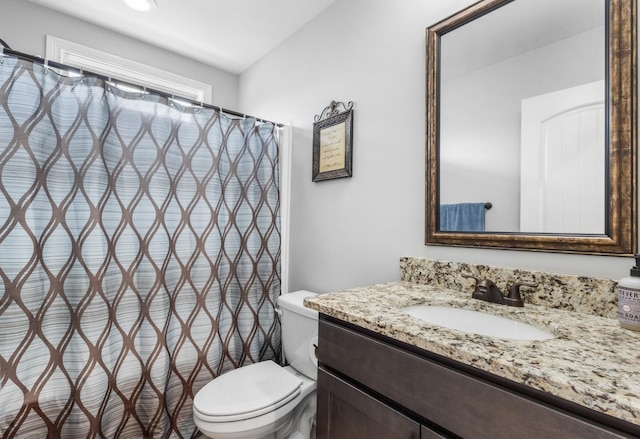 full bathroom with vanity and toilet