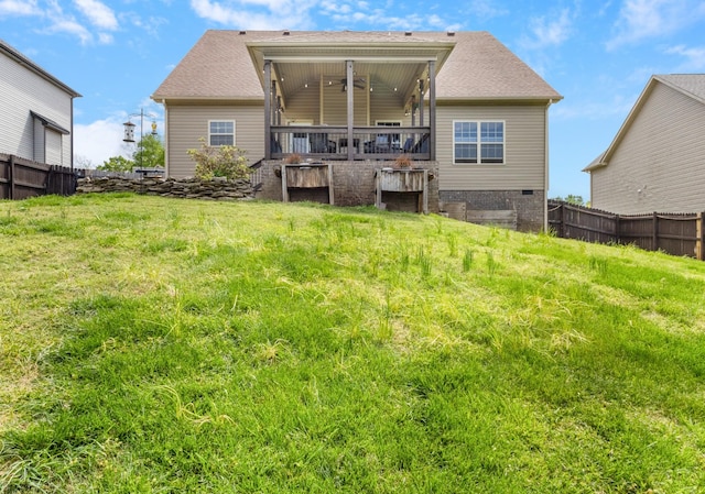 rear view of property with fence
