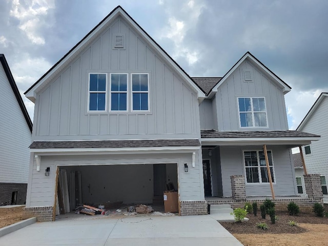 4811 Kintore, Nolensville, TN 37135 - view of front of property featuring board and batten siding, covered porch, concrete driveway, and an attached garage