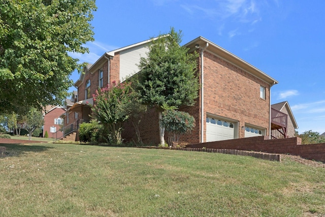 101 Christina Ct, Goodlettsville, TN 37072 - view of side of home featuring a yard, a garage, and brick siding