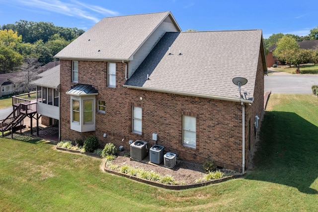 101 Christina Ct, Goodlettsville, TN 37072 - view of side of property featuring central air condition unit, a shingled roof, and brick siding