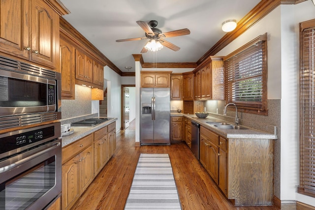 101 Christina Ct, Goodlettsville, TN 37072 - kitchen with tasteful backsplash, ornamental molding, ceiling fan, stainless steel appliances, and a sink