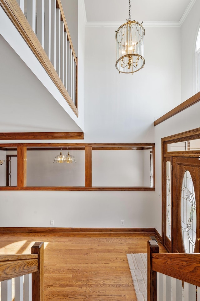101 Christina Ct, Goodlettsville, TN 37072 - foyer featuring a chandelier, crown molding, and wood finished floors