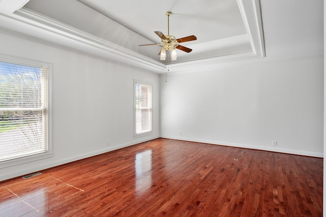101 Christina Ct, Goodlettsville, TN 37072 - spare room featuring visible vents, a raised ceiling, ornamental molding, ceiling fan, and wood finished floors