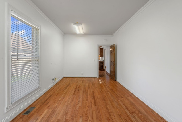 101 Christina Ct, Goodlettsville, TN 37072 - spare room featuring crown molding, visible vents, baseboards, and light wood-type flooring
