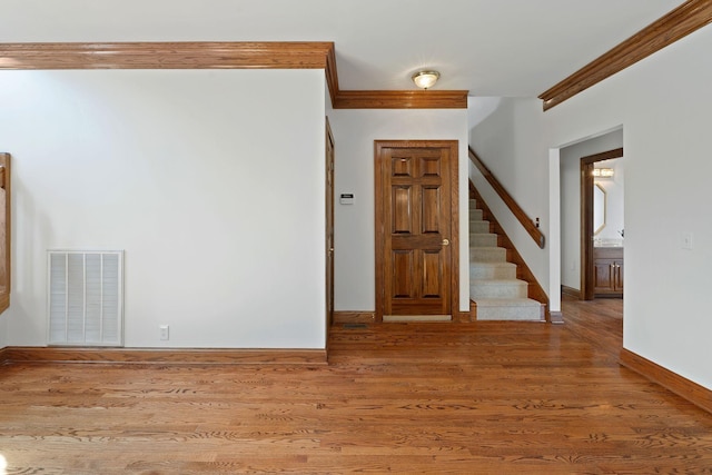 101 Christina Ct, Goodlettsville, TN 37072 - entryway featuring ornamental molding, visible vents, wood finished floors, stairs, and baseboards