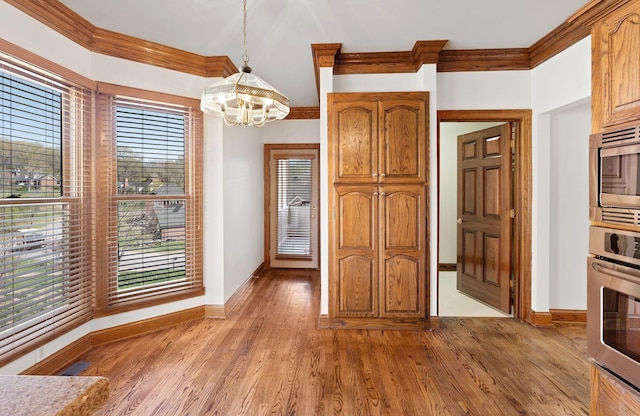 101 Christina Ct, Goodlettsville, TN 37072 - unfurnished dining area featuring a chandelier, light wood-type flooring, and baseboards