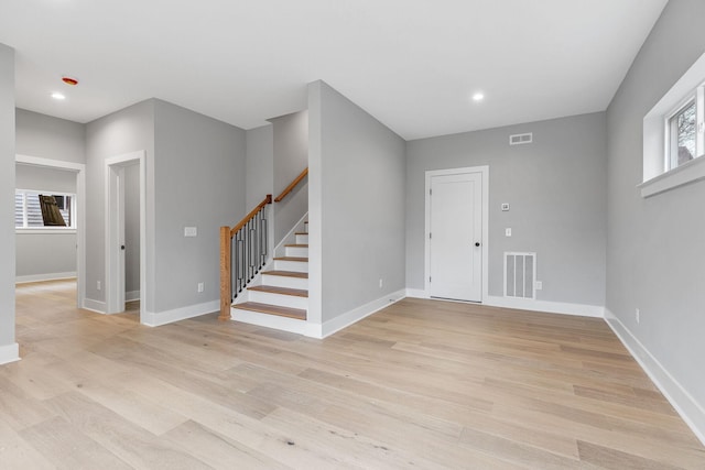 3904 Nevada Ave, Nashville, TN 37209 - entrance foyer with stairs, visible vents, baseboards, and light wood-style flooring