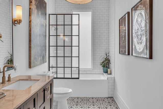 full bath featuring tile patterned flooring, toilet, vanity, and a tub