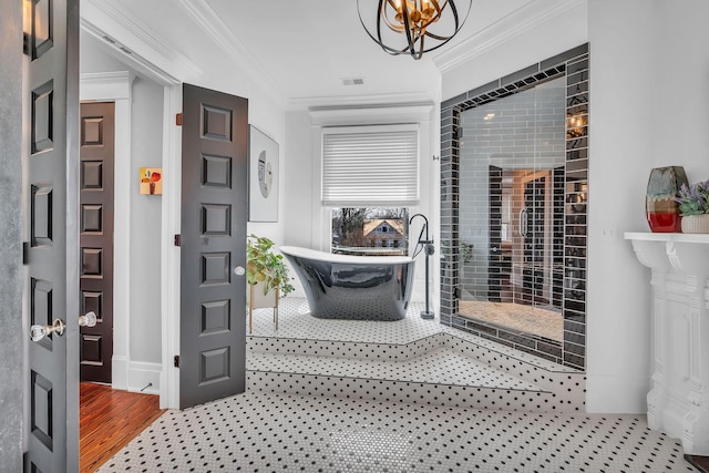 interior space featuring baseboards, visible vents, a chandelier, and ornamental molding
