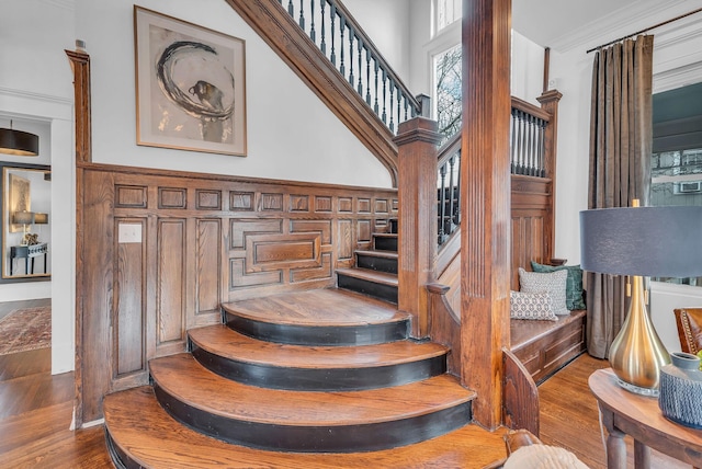 staircase featuring wood finished floors