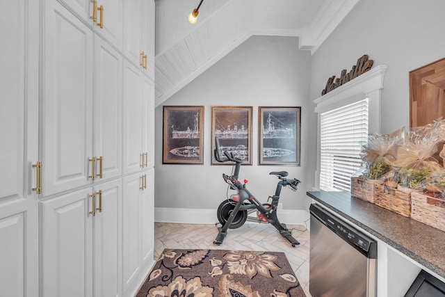 exercise room with lofted ceiling, marble finish floor, baseboards, and ornamental molding