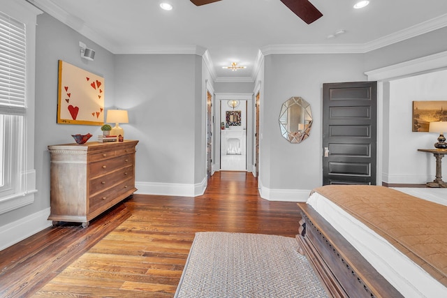 bedroom with baseboards, wood finished floors, and recessed lighting