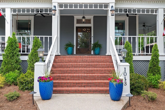 entrance to property with a ceiling fan and covered porch
