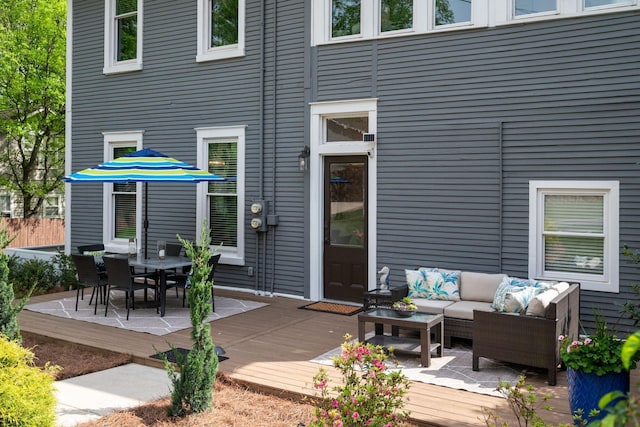 back of property featuring outdoor lounge area and a deck