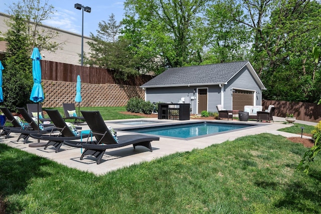 view of swimming pool with a fenced in pool, an outbuilding, fence, an outdoor hangout area, and a yard