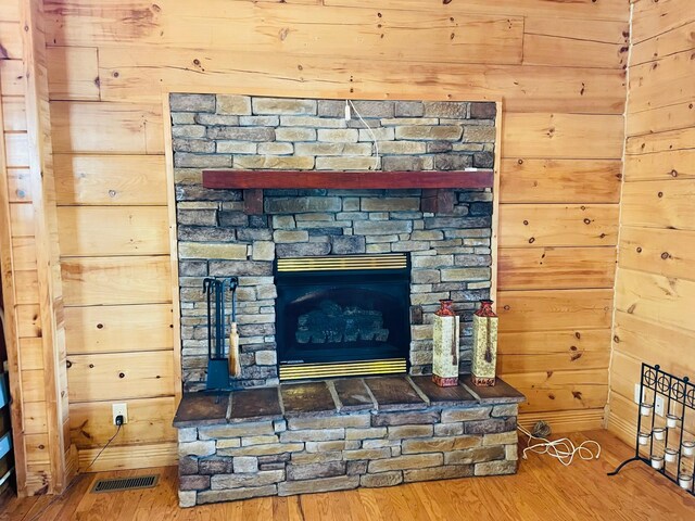 1041 High Meadow Dr, Spencer, TN 38585 - interior details with wooden walls, visible vents, baseboards, and wood finished floors