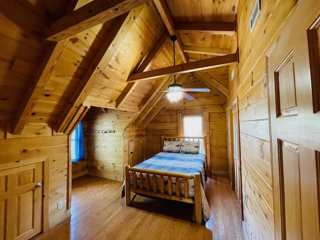 1041 High Meadow Dr, Spencer, TN 38585 - bedroom with wood ceiling, wood walls, light wood finished floors, and vaulted ceiling with beams