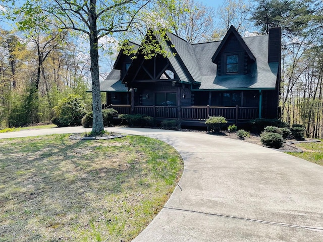 1041 High Meadow Dr, Spencer, TN 38585 - log home featuring a front yard, a shingled roof, a porch, a chimney, and curved driveway