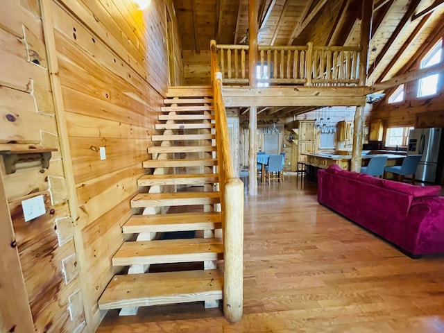 1041 High Meadow Dr, Spencer, TN 38585 - staircase featuring wood walls, wooden ceiling, vaulted ceiling, and wood finished floors