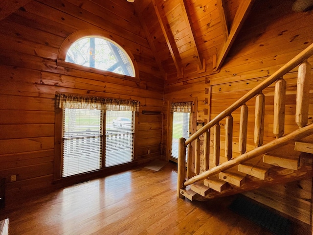 1041 High Meadow Dr, Spencer, TN 38585 - interior space featuring stairway, wood walls, beamed ceiling, wood ceiling, and wood finished floors