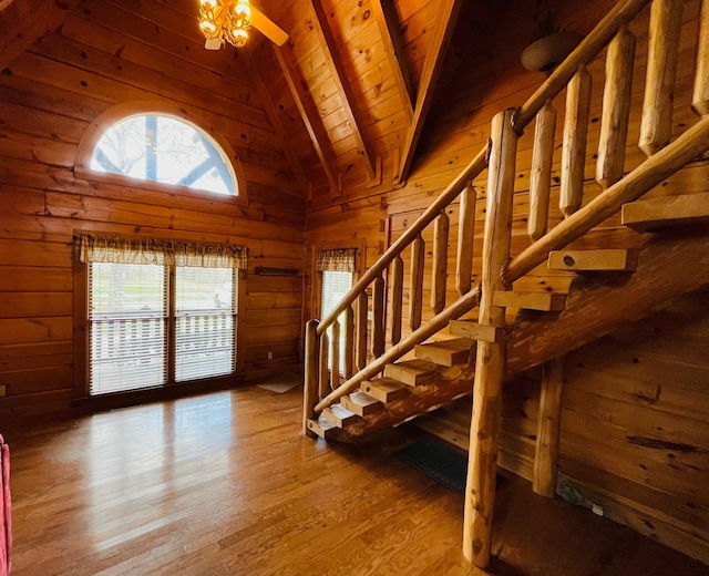 1041 High Meadow Dr, Spencer, TN 38585 - staircase with wood walls, beam ceiling, high vaulted ceiling, wood ceiling, and wood finished floors