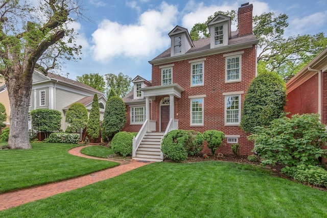 234 Myles Manor Ct, Franklin, TN 37064 - view of front of property with a front lawn, a chimney, and brick siding