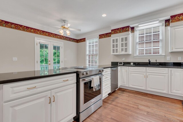234 Myles Manor Ct, Franklin, TN 37064 - kitchen with glass insert cabinets, a sink, appliances with stainless steel finishes, ceiling fan, and french doors