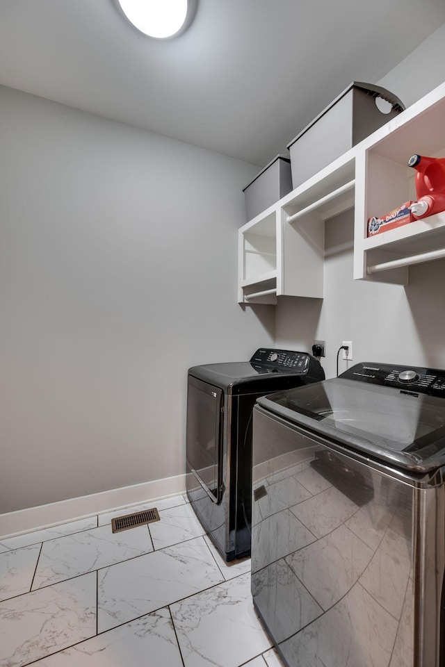 72 Twin St, Nashville, TN 37209 - laundry room with baseboards, visible vents, laundry area, washer and dryer, and marble finish floor