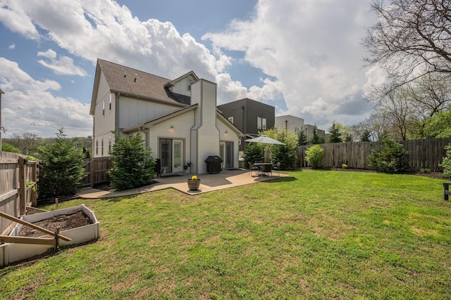 72 Twin St, Nashville, TN 37209 - back of house with a garden, a fenced backyard, and a lawn