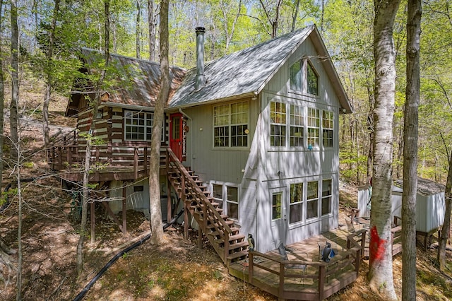 497 Aaron Webb Rd, Smithville, TN 37166 - rear view of property featuring roof with shingles, a deck, and stairs
