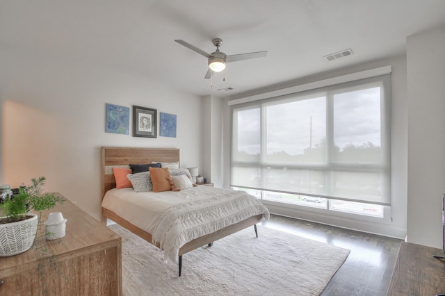 bedroom with wood finished floors and a ceiling fan