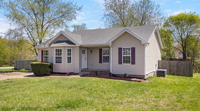 438 Pacific Ave, Oak Grove, KY 42262 - view of front of house featuring central AC unit, a front lawn, fence, and roof with shingles