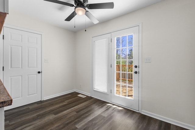 438 Pacific Ave, Oak Grove, KY 42262 - doorway to outside with a ceiling fan, baseboards, dark wood finished floors, and visible vents