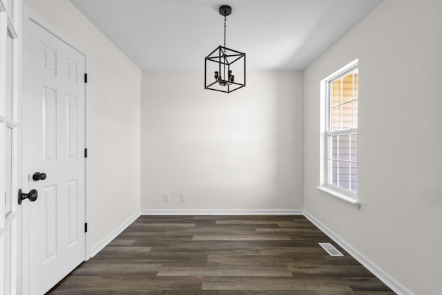 438 Pacific Ave, Oak Grove, KY 42262 - unfurnished dining area featuring an inviting chandelier, baseboards, dark wood-style floors, and visible vents
