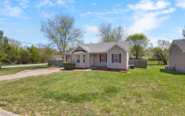 438 Pacific Ave, Oak Grove, KY 42262 - view of front of home with central AC unit, fence, and a front lawn