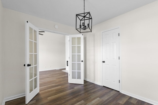 438 Pacific Ave, Oak Grove, KY 42262 - unfurnished dining area with dark wood-style flooring, french doors, baseboards, and a notable chandelier