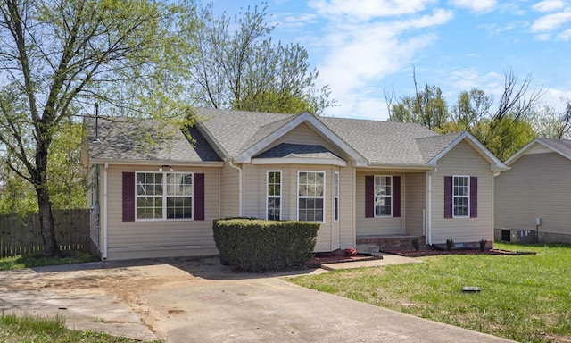 438 Pacific Ave, Oak Grove, KY 42262 - view of front of house with central AC unit, a shingled roof, a front yard, and fence