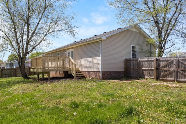 438 Pacific Ave, Oak Grove, KY 42262 - rear view of house with fence and a wooden deck