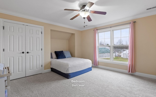 bedroom with carpet, baseboards, and crown molding