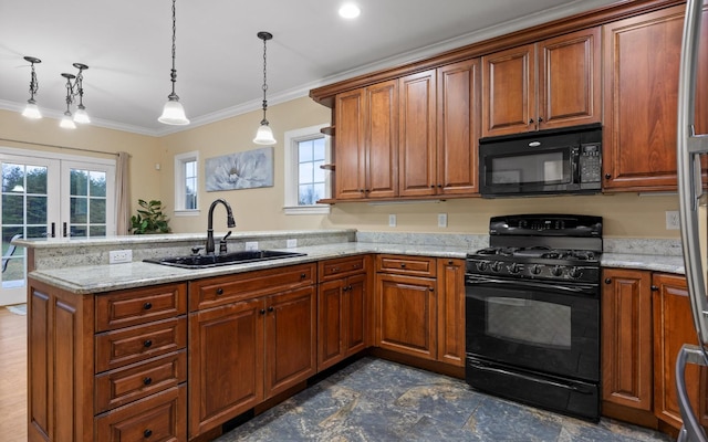kitchen with brown cabinetry, a peninsula, ornamental molding, black appliances, and a sink