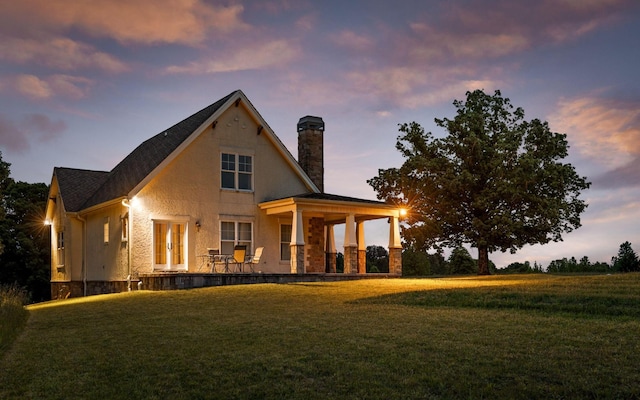 10600 Skyridge Trl, Soddy Daisy, TN 37379 - back of house at dusk with a chimney and a yard