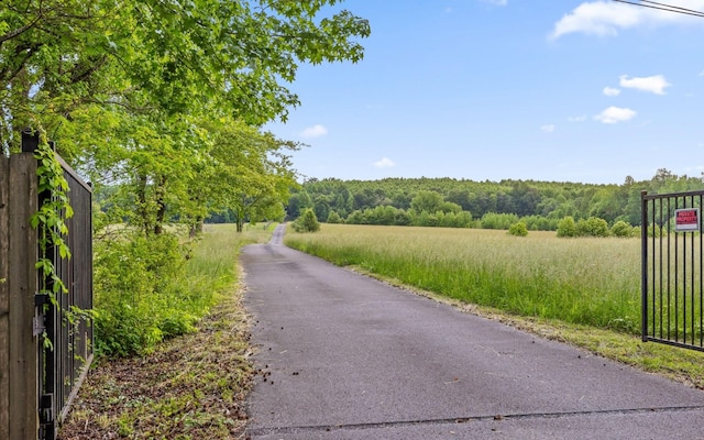 10600 Skyridge Trl, Soddy Daisy, TN 37379 - view of asphalt road with a forest view and a gated entry