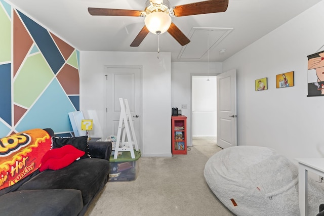 game room with carpet floors, a ceiling fan, baseboards, and attic access