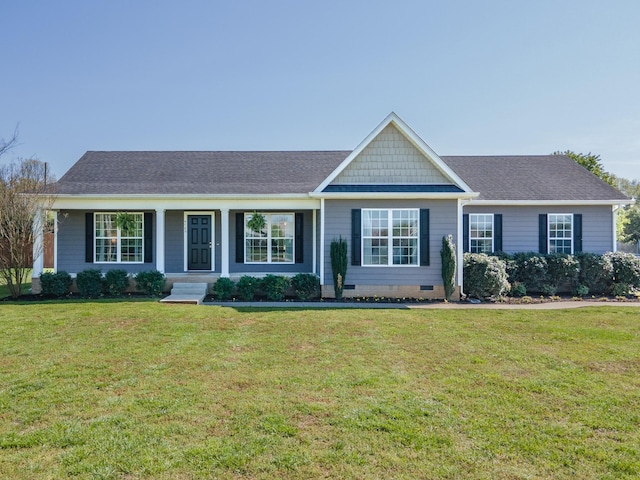 ranch-style home featuring a shingled roof, crawl space, and a front lawn