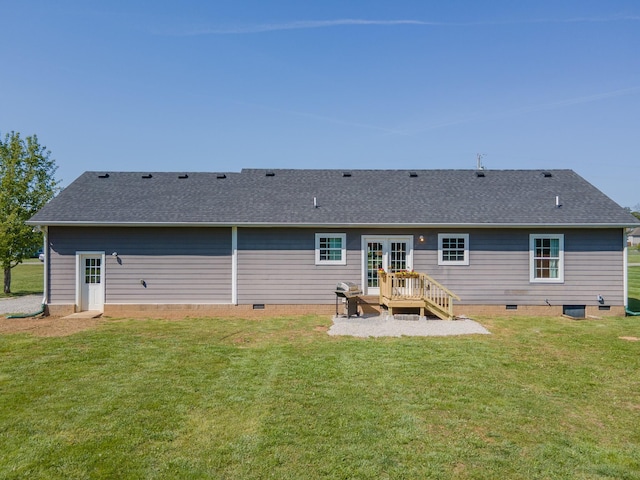 back of house featuring french doors, a lawn, crawl space, and roof with shingles